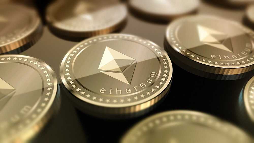 A collection of ethereum coins displayed on a dark background, emphasizing the potential to invest in cryptocurrency.